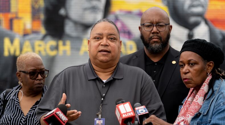 Atlanta city Councilman Michael Bond speaks to the media regarding recent violence in Vine City. Community members and city leaders gather to speak and demand action on gun violence in the Vine City area. Wednesday, April 10th, 2024 (Ben Hendren for the Atlanta Journal Constitution)