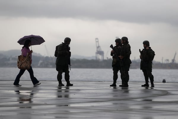 Members of the Brazilian Navy patrol along the Guanabara Bay waterfront, ahead of the upcoming 17th annual BRICS summit, in Rio de Janeiro, Thursday, July 3, 2025. (AP Photo/Bruna Prado)