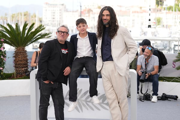 Sergi Lopez, from left, Bruno Nunez, and director Oliver Laxe pose for photographers at the photo call for the film 'Sirat' at the 78th international film festival, Cannes, southern France, Friday, May 16, 2025. (AP Photo/Natacha Pisarenko)