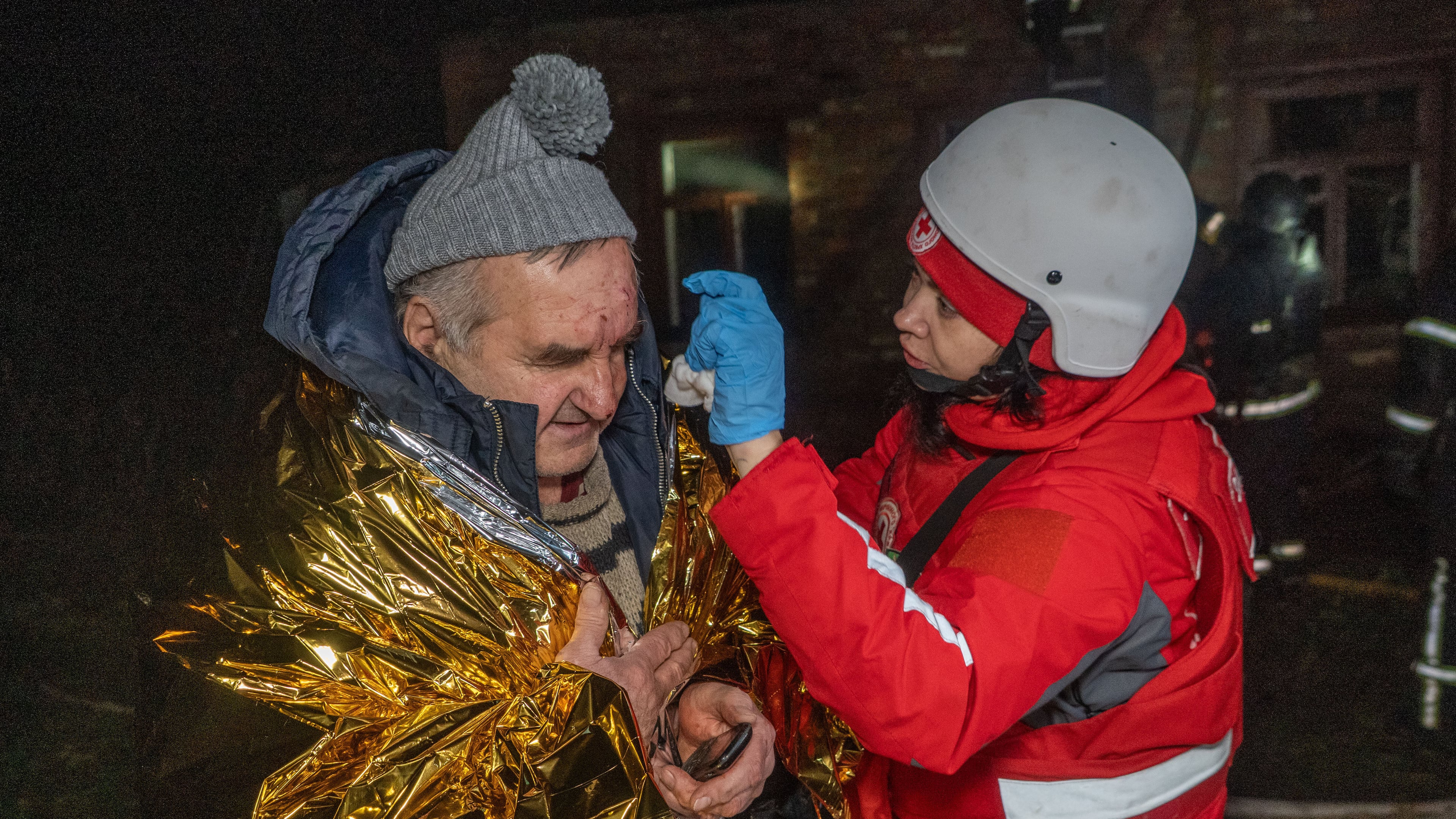 A paramedic gives first aid to a resident who was injured in a Russian airstrike in Kharkiv, Ukraine, late Sunday, Nov. 23, 2025. (AP Photo/Andrii Marienko)