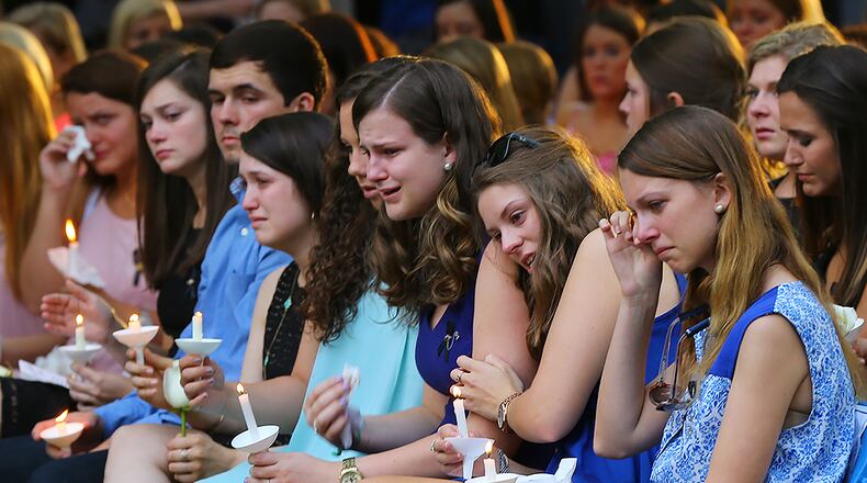 Students hold candles during the Memorial Service on Sweetheart Circle at Georgia Southern University for the five nursing students who died in a vehicle pileup on April 22, 2015, in Statesboro. Curtis Compton / ccompton@ajc.com