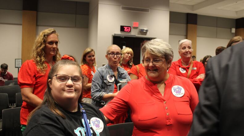 Ashlynn Rich, left, and her mother Linda Ramirez, right, at the June meeting of the Cobb County School Board.