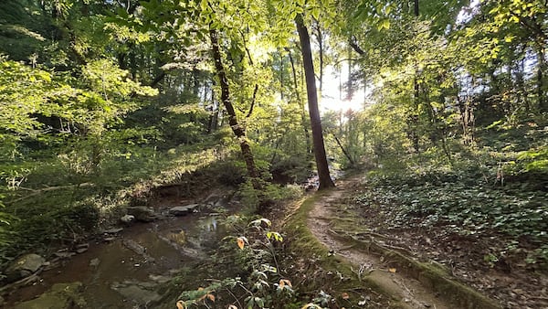 A path on the grounds of Ignatius House along the Chattahoochee River in Cobb County. (AJ Willingham/AJC)