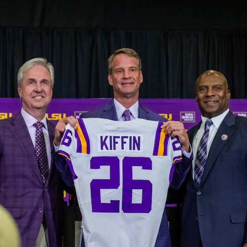 LSU president Wade Rousse and athletic director Verge Ausberry pose with new head football coach Lane Kiffin after an introductory news conference, Monday, Dec. 1, 2025, in Baton Rouge, La. (Michael Johnson/The Advocate via AP)