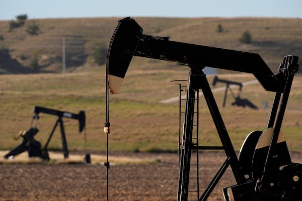 FILE - Pumpjacks operate in a pasture, Sept. 30, 2024, near Hays, Kan. (AP Photo/Charlie Riedel, File)