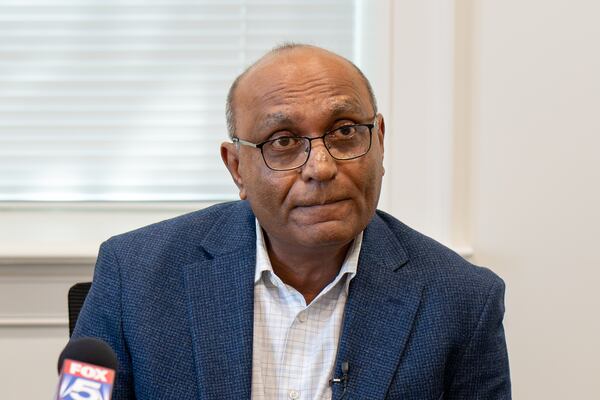 Mahendra Patel speaks at a press conference regarding a lawsuit filed in response to his March 2025 arrest, Monday, Feb. 9, 2026. (Ben Hendren for the AJC)