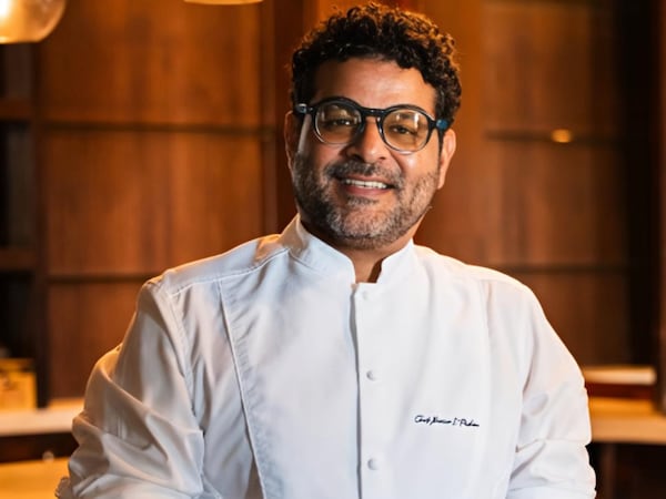 Chef Xavier Pacheco poses in his kitchen.