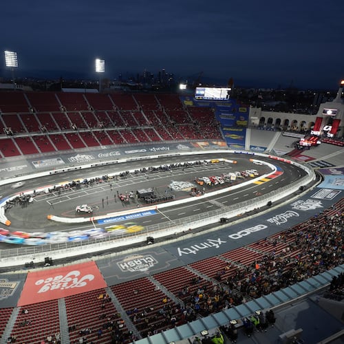 FILE - Cars race during the Busch Light Clash NASCAR exhibition auto race at Los Angeles Memorial Coliseum, Feb. 3, 2024, in Los Angeles. (AP Photo/Mark J. Terrill, File)