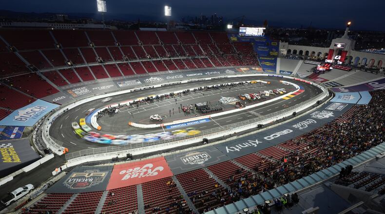 FILE - Cars race during the Busch Light Clash NASCAR exhibition auto race at Los Angeles Memorial Coliseum, Feb. 3, 2024, in Los Angeles. (AP Photo/Mark J. Terrill, File)