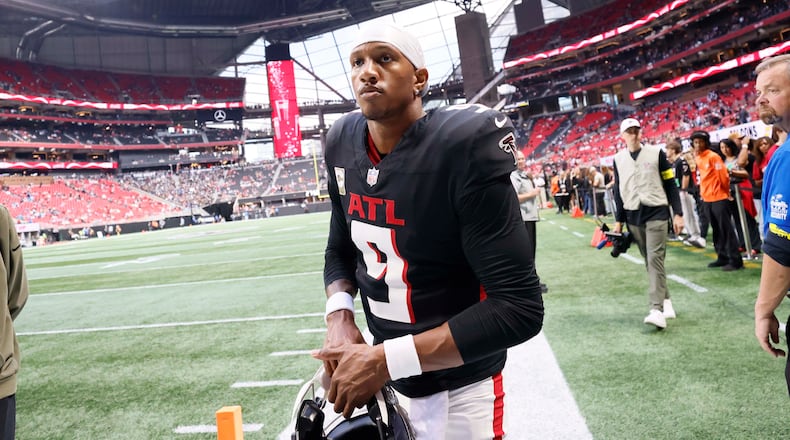Atlanta Falcons quarterback Michael Penix Jr. leaves the field after warm-ups as the team prepares to face the Carolina Panthers at Mercedes-Benz Stadium in Atlanta on Sunday, Nov. 16, 2025. (Miguel Martinez/AJC)