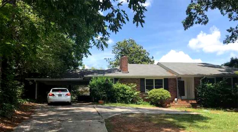 A house and land at 650 Hammond Drive, Sandy Springs, is being sold for $410,000 to the city, which plans to eventually demolish it for a widening of the street. CITY OF SANDY SPRINGS