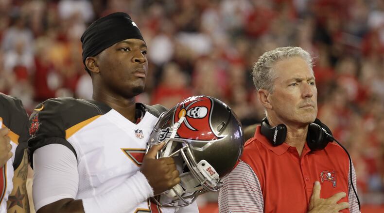 Tampa Bay Buccaneers quarterback Jameis Winston (3) and head coach Dirk Koetter before an NFL football game against the Cleveland Browns Friday, Aug. 26, 2016, in Tampa, Fla. (AP Photo/Chris O’Meara)