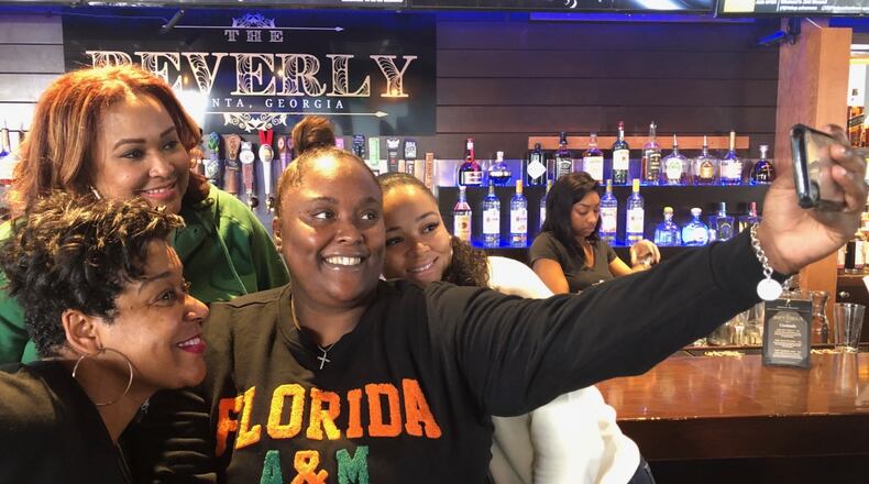 Gabby Albert, Tamara Crockett, Amber Spencer and Talibah McIntyre-Handy share a selfie during a FAMU brunch before the Honda Battle of the Bands, put on by their group, The Litty Committee. (Marlon A. Walker/AJC)