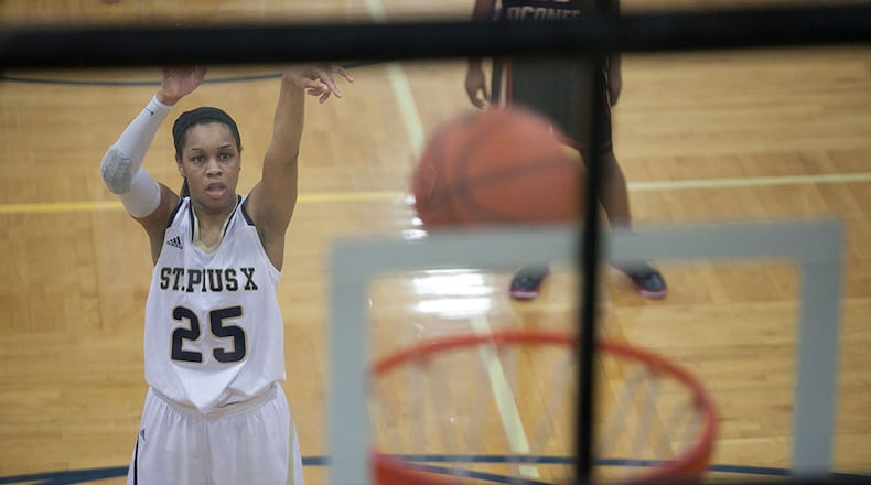 February 21, 2014 Atlanta- St. Pius player Asia Durr (25) takes a shot from the free-throw line during a High School basketball game on Friday, Feb. 21, 2014, in Atlanta, Ga. St. Pius defeated North Oconee 52-49 in the first round of the high school state tournament. BRANDEN CAMP/SPECIAL St. Pius player Asia Durr (25) takes a shot from the free-throw line. (Branden Camp / Special to AJC)