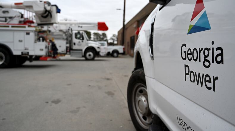 Georgia Power trucks are shown staged at a site in metro Atlanta on Saturday, Jan. 24, 2026, in Atlanta. (Hyosub Shin/AJC)