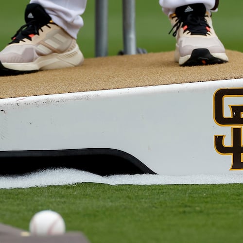 FILE - Detailed view of a San Diego Padres logo on a pitching mound during batting practice prior to a baseball game between the Padres and Boston Red Sox, May 20, 2023, in San Diego. (AP Photo/Brandon Sloter, File)