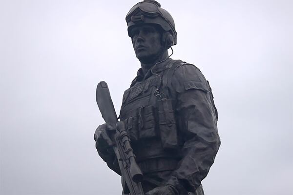 A statue of Master Sgt. Gary Gordon in Lincoln, Maine. Gordon, who died in 1993 while attempting to rescue a downed U.S. helicopter pilot in Mogadishu, was posthumously awarded the Medal of Honor. (Mark Rediker/WABI-TV5 via AP 2021)