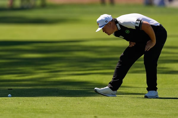 Sungjae Im lines up his shot on the fairway of the eighth hole during the first round of the RBC Heritage golf tournament, Thursday, April 17, 2025, in Hilton Head Island, S.C. (AP Photo/Mike Stewart)
