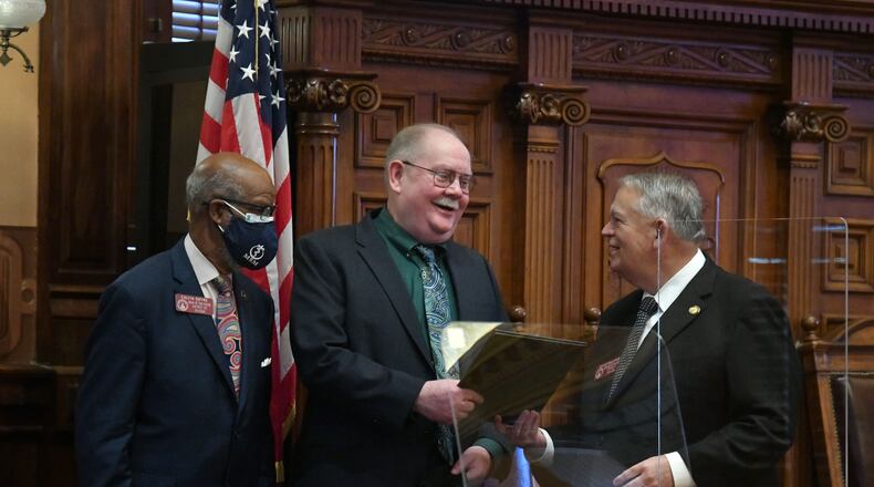 January 14, 2021 Atlanta - Jim Galloway, AJC political columnist, is recognized and honored as Rep. Calvin Smyre (left) and David Ralston, Speaker of the House, look in the House Chambers during the 4th day of the 2021 legislative session at the Georgia State Capitol building on Thursday, January 14, 2021. (Hyosub Shin / Hyosub.Shin@ajc.com)
