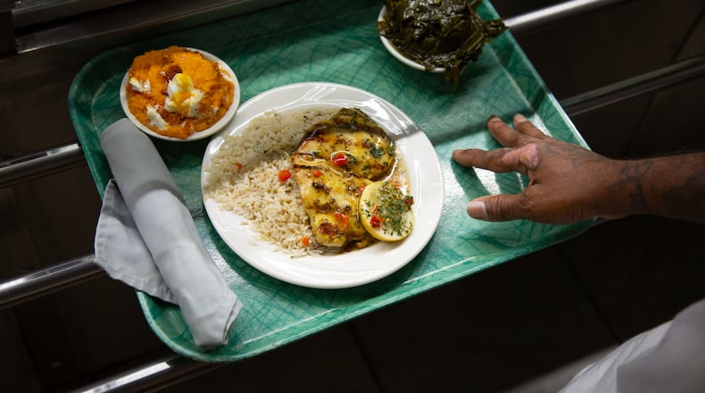 A customer moves down the cafeteria line at Magnolia Room in Tucker. Martha Williams for The Atlanta Journal-Constitution