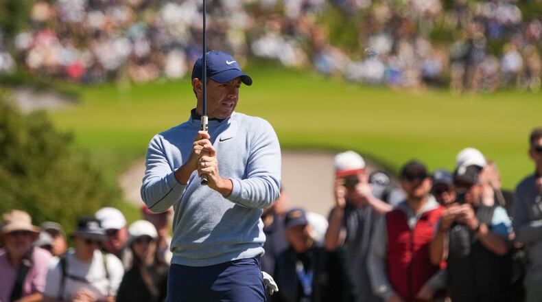 Rory McIlroy, of Northern Ireland, reacts after putting on the fourth hole during the fourth round of the Australian Open golf tournament in Melbourne, Australia, Sunday, Dec. 7, 2025. (AP Photo/Asanka Brendon Ratnayake)