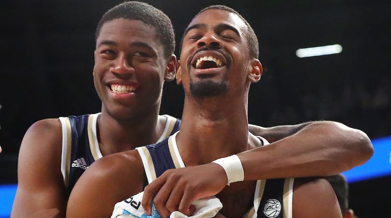 Georgia Tech forward Moses Wright (left) gives guard Curtis Haywood II a hug Sunday, March 3, 2019, during game against Boston College in Atlanta.