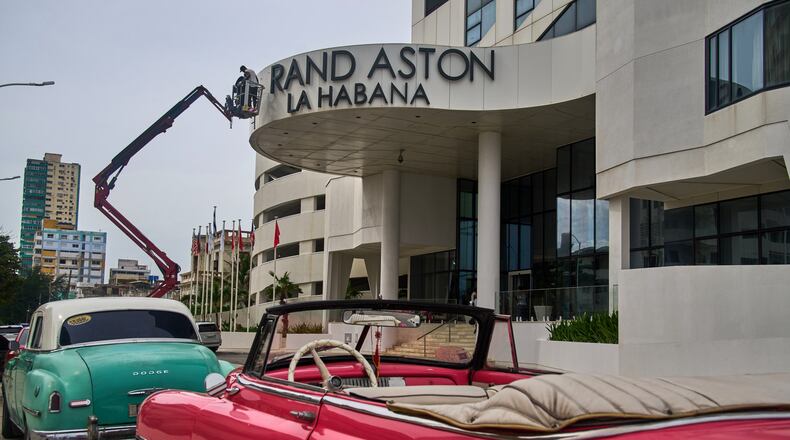 Workers repair the sign at the Grand Aston Hotel in Havana, Wednesday, June 3, 2026. (AP Photo/Ramon Espinosa)