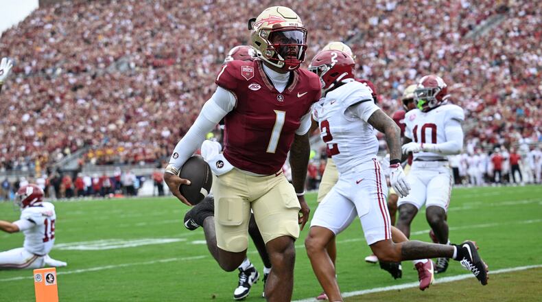 FILE - Florida State quarterback Tommy Castellanos (1) rushes for a touchdown against Alabama during the first half of an NCAA college football game, Saturday, Aug. 30, 2025, in Tallahassee, Fla. (AP Photo/Phelan M. Ebenhack,File)
