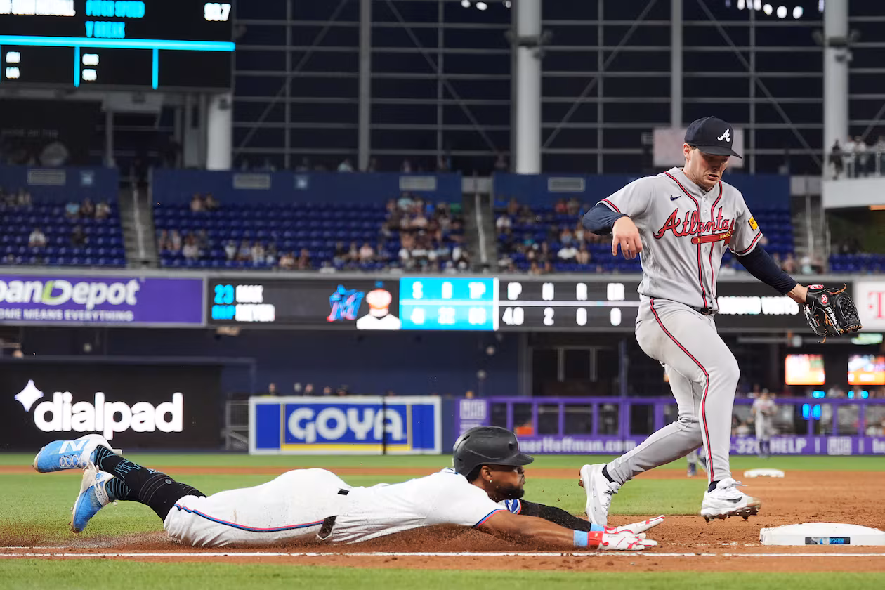 Atlanta Braves starting pitcher JR Ritchie, right, runs to get out Miami Marlins' Otto Lopez at first base on a ground out, during the fourth inning of a baseball game, Monday, May 18, 2026, in Miami. (Rebecca Blackwell/AP)
