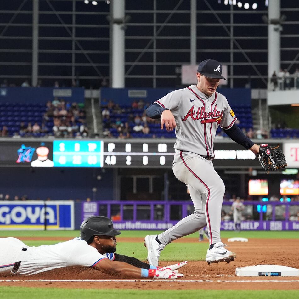 Atlanta Braves starting pitcher JR Ritchie, right, runs to get out Miami Marlins' Otto Lopez at first base on a ground out, during the fourth inning of a baseball game, Monday, May 18, 2026, in Miami. (Rebecca Blackwell/AP)