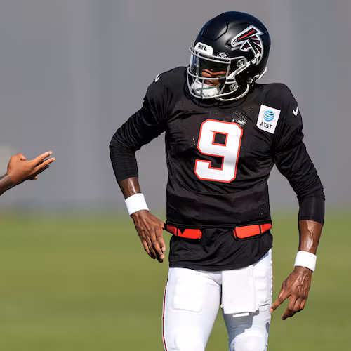 Atlanta Falcons quarterback Michael Penix Jr. (9) and Tua Tagovailoa speak during a Atlanta Falcons training camp, Monday, Aug. 3, 2026, in Flowery Branch, Ga. (AP Photo/Mike Stewart)
