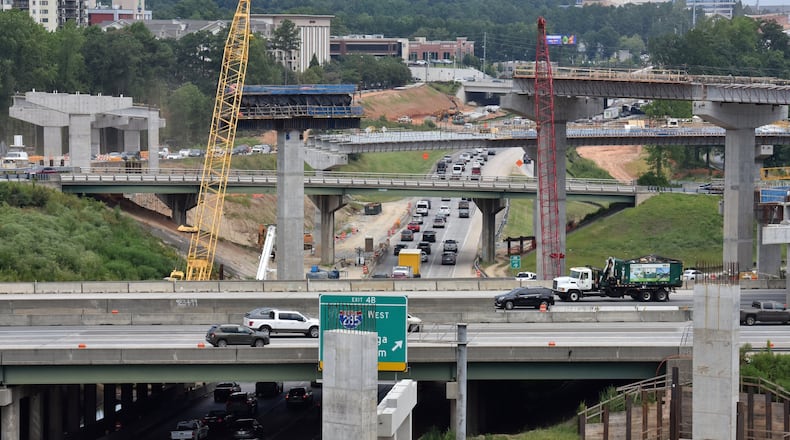 One of metro Atlanta’s worst traffic bottlenecks — the junction of I-285 and Ga. 400 — is now a massive construction zone. The Georgia Department of Transportation is spending $800 million to rebuild the interchange. (Hyosub Shin / Hyosub.Shin@ajc.com)