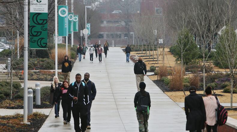 A $1.25 million “Pedestrian Pathways” project to build more sidewalks between buildings and parking lots of Georgia Gwinnett College is among about 100 transportation endeavors delayed in the state by uncertainty over federal funding. The project would also build handicap ramps and crosswalks on the Gwinnett college campus, seen here in December 2013. BOB ANDRES / BANDRES@AJC.COM