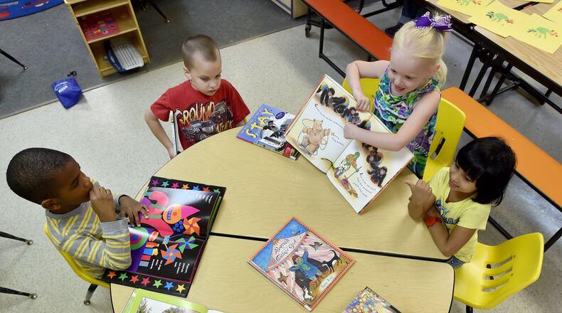 April 5, 2015: Pre-k students at Sunshine House in Lilburn look at books during activities time. BRANT SANDERLIN/BSANDERLIN@AJC.COM
