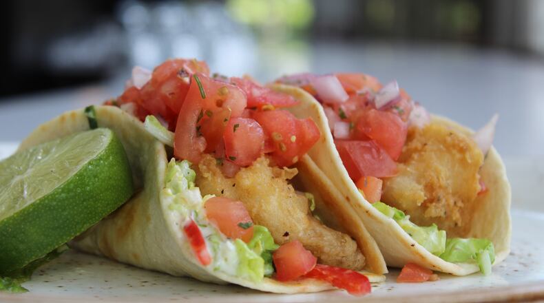 Take a bite out of fish tacos, which are two for $5 at Savor Bar & Kitchen today. Photo credit: M-Squared Public Relations.