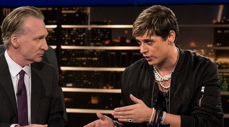 In this photo provided by HBO, host Bill Maher, left, listens to Milo Yiannopoulos, a writer for Breitbart News, on HBO's "Real Time with Bill Maher," Friday, Feb. 17, 2017, in Los Angeles. (Janet Van Ham/HBO via AP)