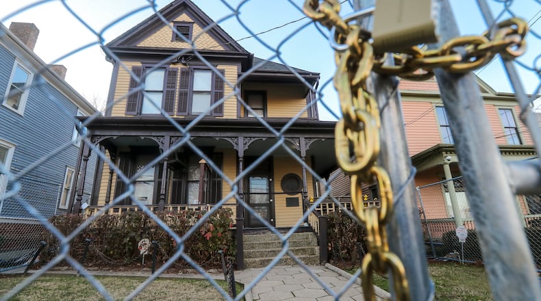 A fence surrounds the birth home of the Rev. Martin Luther King Jr. located at 501 Auburn Avenue NE, in Atlanta (shown here on Thursday, Jan. 11, 2024) after bystanders thwarted an arson attempt a month ago. The National Park Service has been working to secure the historic site while also keeping it accessible to the public. (John Spink / John.Spink@ajc.com)