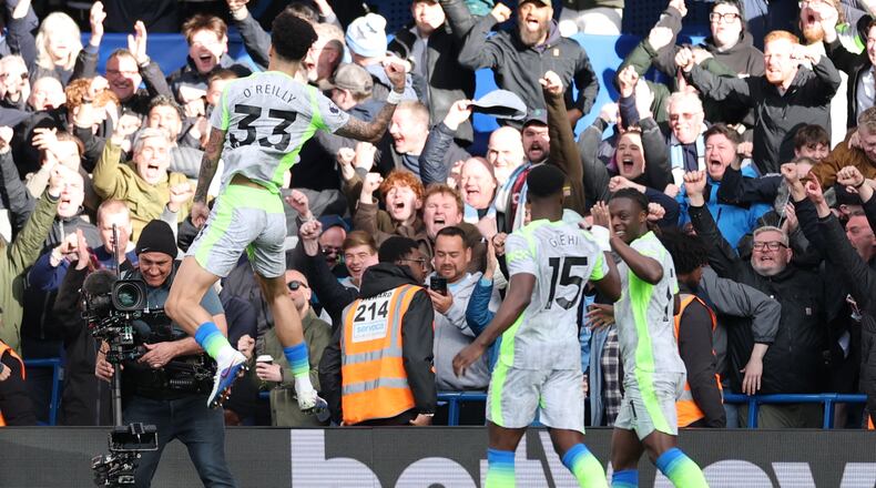 Manchester City's Nico O'Reilly celebrates after scoring during the Premier League soccer match between Chelsea and Manchester City in London, Sunday, April 12, 2026. (AP Photo/Ian Walton)