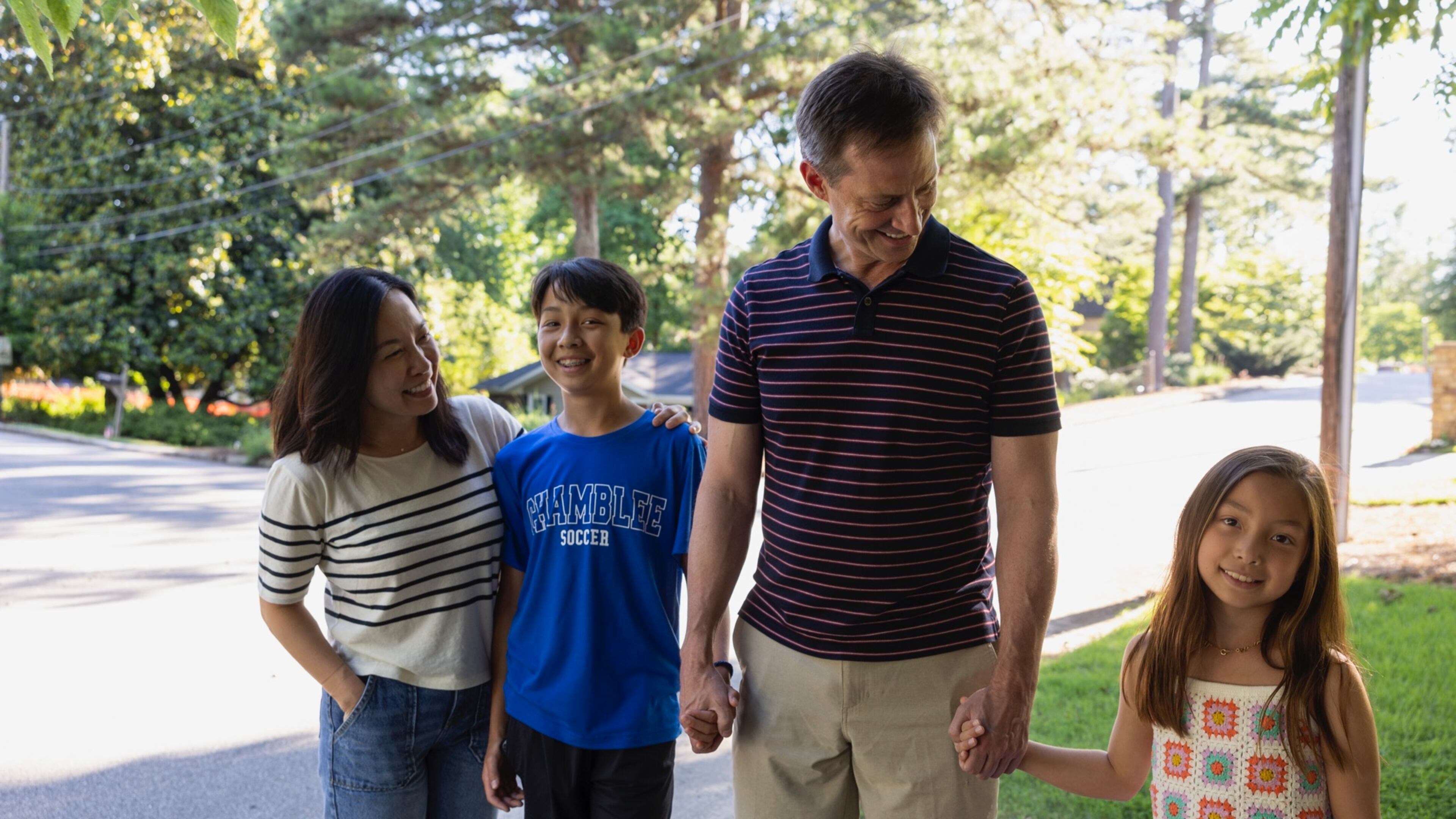 Dr. James Rilling, psychology professor at Emory University and director of the Laboratory for Darwinian Neuroscience, holds hands with his two young children alongside his wife. As a professor, researcher and author, Rilling is a local father that’s dedicated to learning about dads. (Courtesy of Kay Hinton, Emory University)