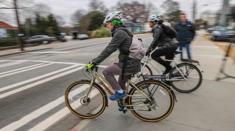 Bike riders enter the intersection at 10th and Monroe Drive from the Beltline, where a developer has proposed building a hotel and residences on four acres. JOHN SPINK /JSPINK@AJC.COM AJC FILE PHOTO