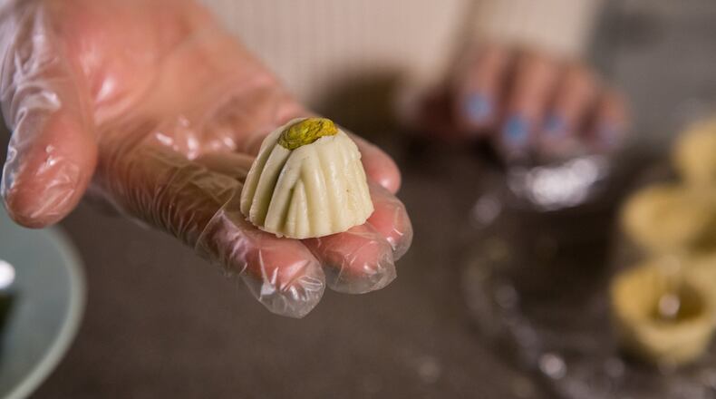 Filled with pistachios or dates or coconut, sometimes rolled in sesame seeds, each cookie that Ruwaida makes is a small work of art. Photo: PHIL SKINNER