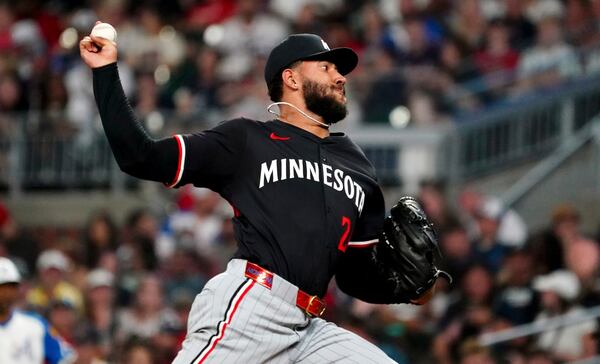 Minnesota Twins pitcher Simeon Woods Richardson (24) cycles through a pitch against the Atlanta Braves during the fourth inning in a baseball game at Truist Park, Saturday, April 19, 2025, in Atlanta. (AP Photo/ John David Mercer)