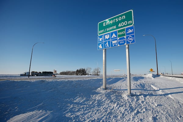 FILE - Road signage is posted just outside of Emerson, Manitoba, Thursday, Jan. 20, 2022. (John Woods/The Canadian Press via AP, File)