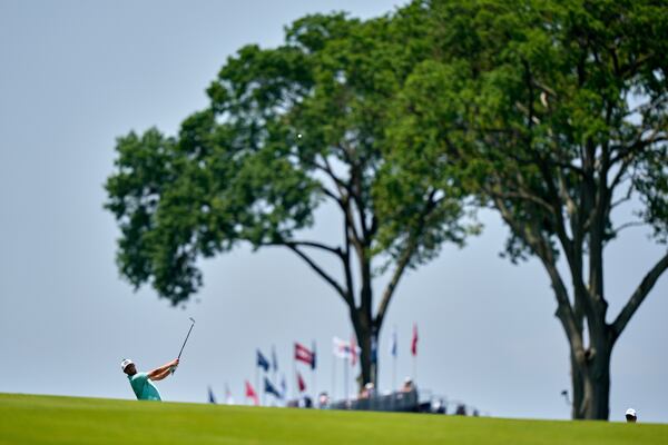 Alistair Docherty hits from the first fairway during a practice round ahead of the U.S. Open golf tournament at Oakmont Country Club Wednesday, June 11, 2025, in Oakmont, Pa. (AP Photo/Charlie Riedel)