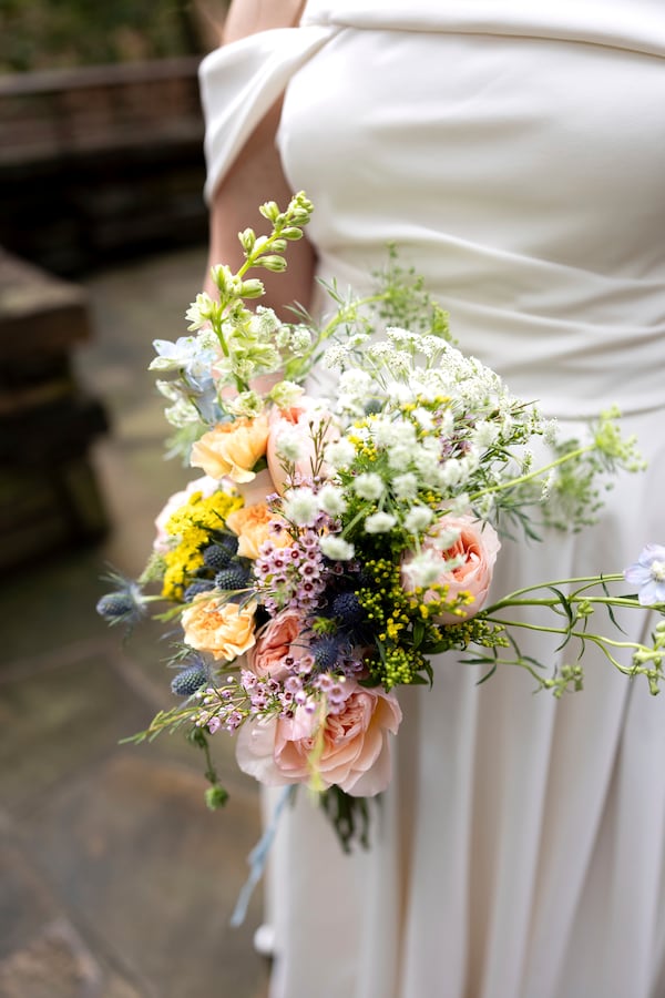 This Sept. 24, 2023, photo shows a bridal bouquet at a wedding in Hot Springs, Ark. Wedding vendors and bridal couples of today have been impacted by U.S. tariffs on countries around the globe. (Madi McGraw Photography via AP).
