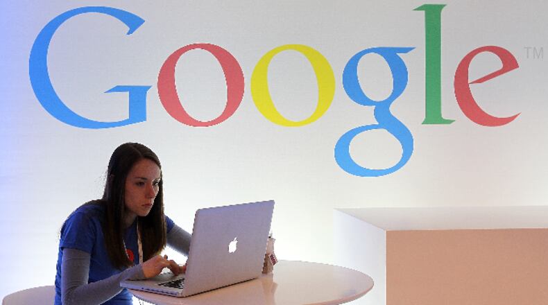 A Google employee works on a laptop before the start of a new conference about Google Maps on June 6, 2012 in San Francisco, California.