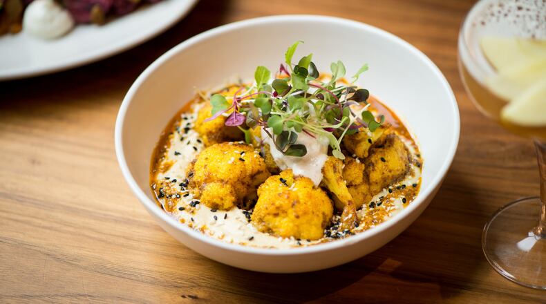 Cauliflower Shawarma with hummus, raita, sesame seeds and pita. Photo credit- Mia Yakel.