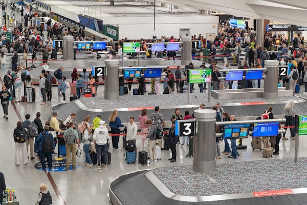 Hourslong waits and flight cancellations continued at Hartsfield-Jackson Atlanta International Airport on Tuesday. (Ben Hendren for the AJC)