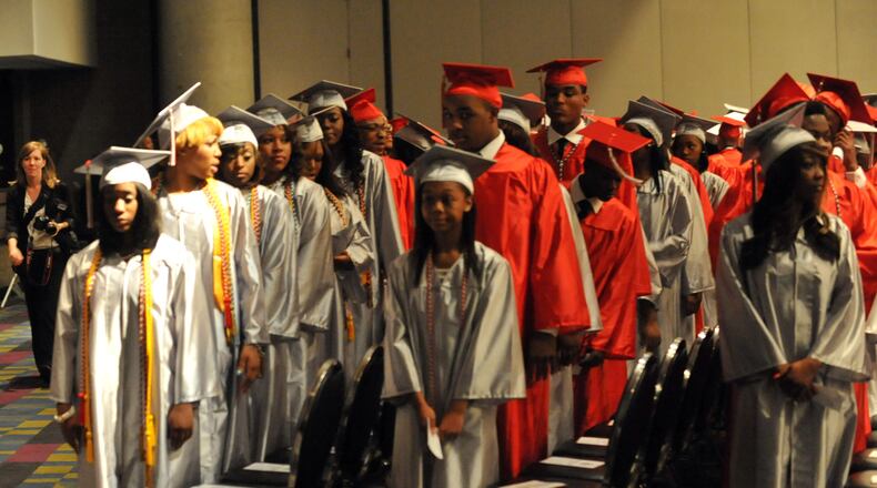 DeKalb County’s McNair High School 2013 seniors graduate at the Georgia World Congress Center. Parents complained in the fall that holding graduation ceremonies the week after students finished classes would likely deplete attendance. So far, the Georgia World Congress Center auditorium has been full for each ceremony. KENT D. JOHNSON / KDJOHNSON@AJC.COM