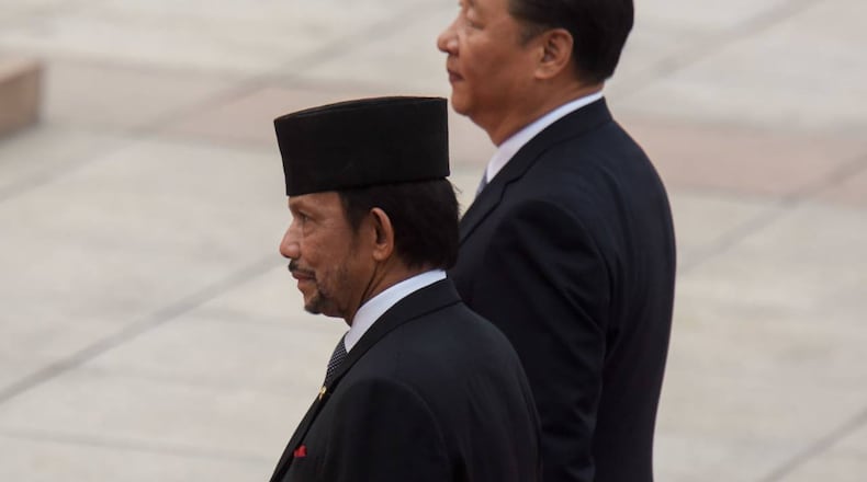 Hassanal Bolkiah, left, the sultan of Brunei, approved the harsh penalties for people engaging in gay sex and adultery.